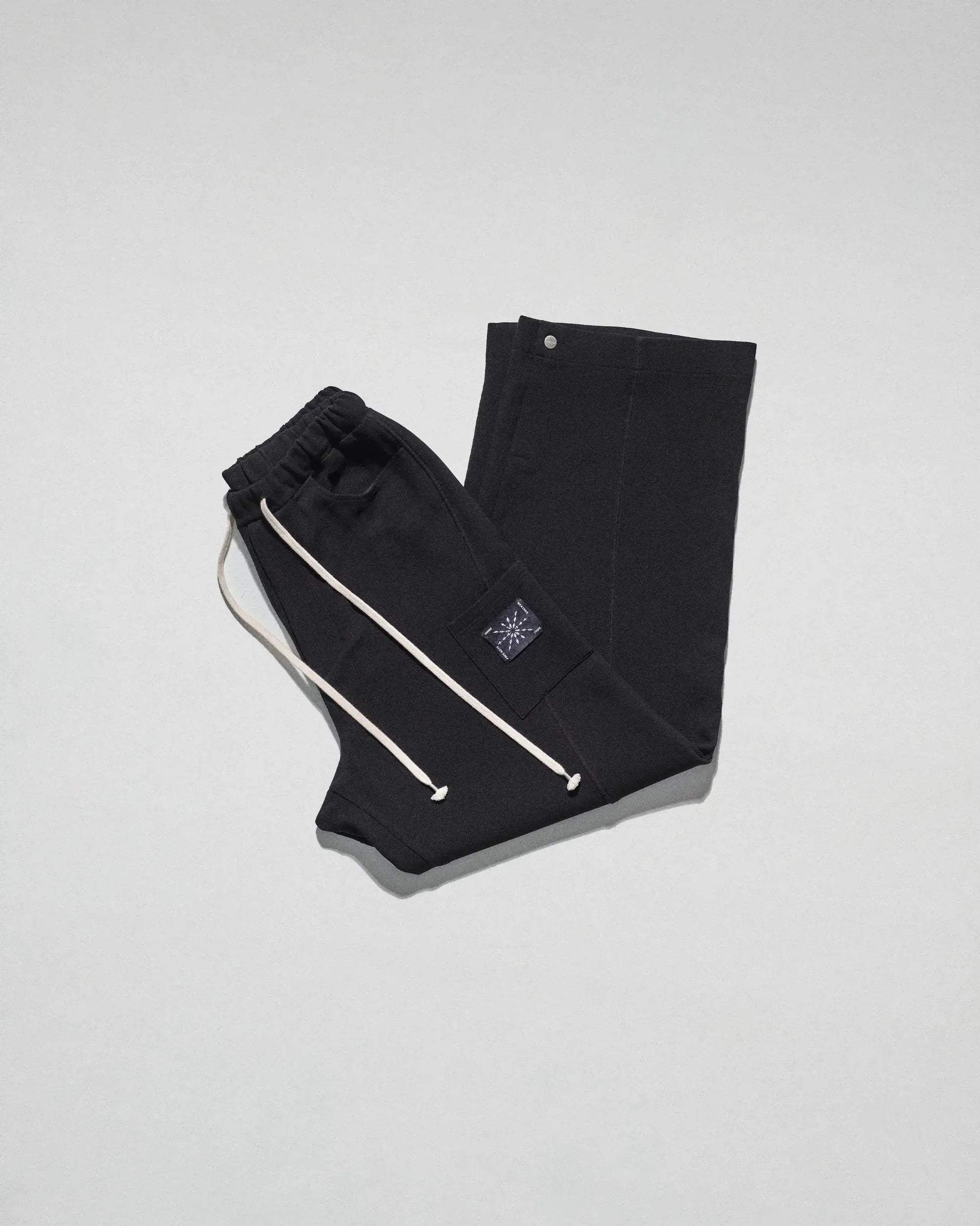 The Crepe Snap Pant in Black by FREE ACTS