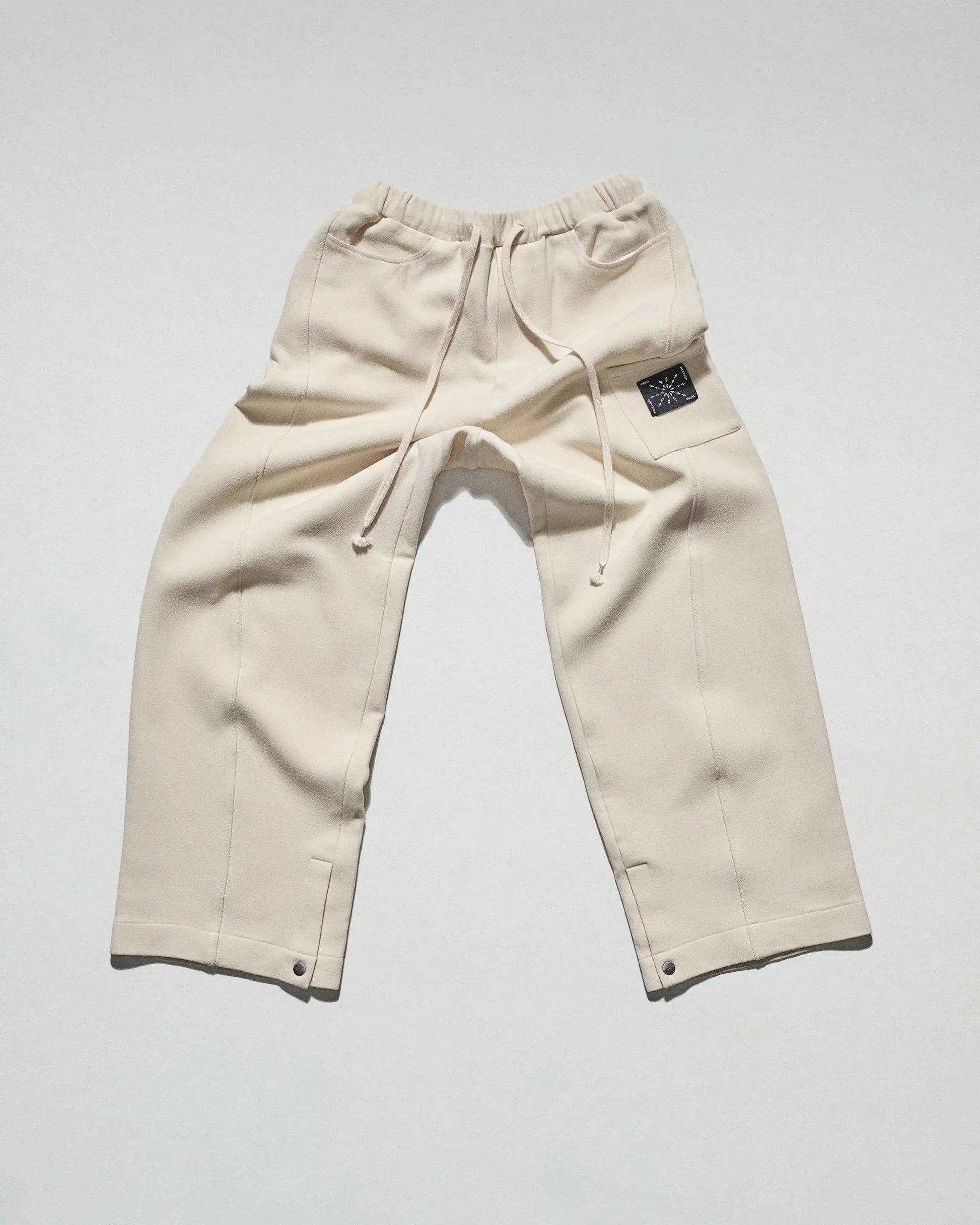 The Crepe Snap Pant in Cream by FREE ACTS