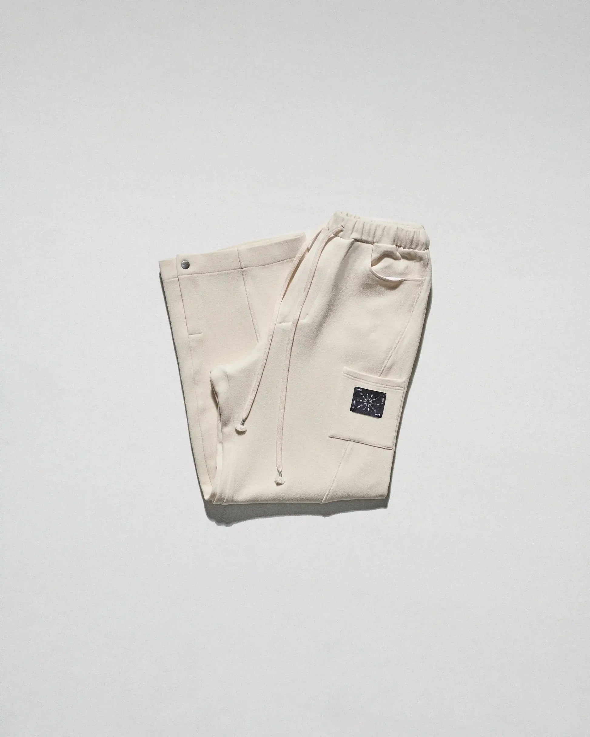 The Crepe Snap Pant in Cream by FREE ACTS