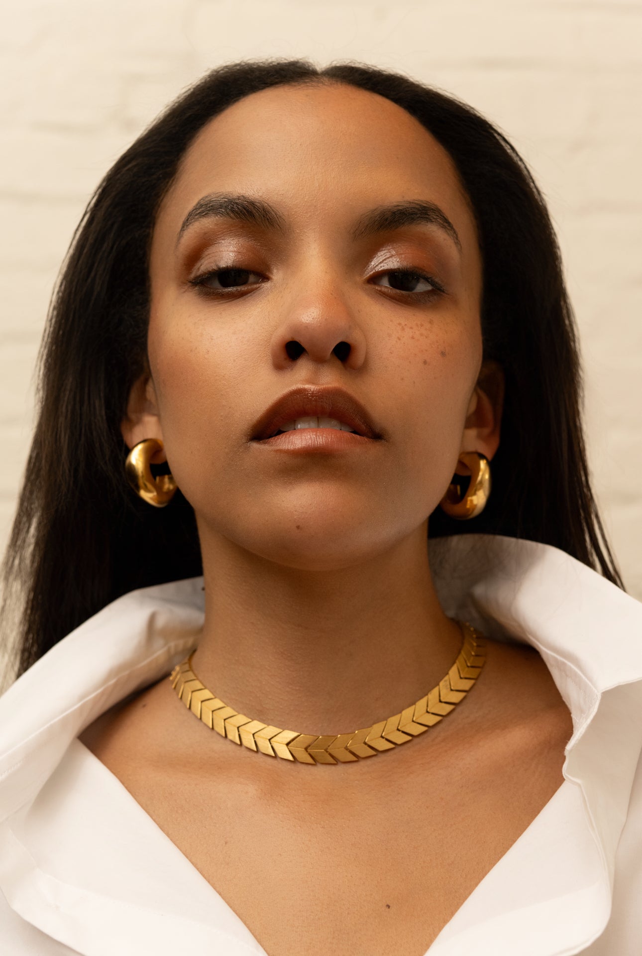 Medium Celia thick hoop earrings in gold vermeil by AGMES from Blackbird Collection's sustainable accessories collection