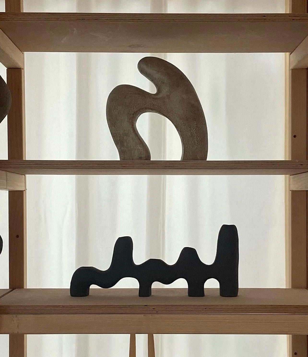 Black ceramic candle holder in organic shape by Aysun Ay from Blackbird Collection's sustainable handmade homeware