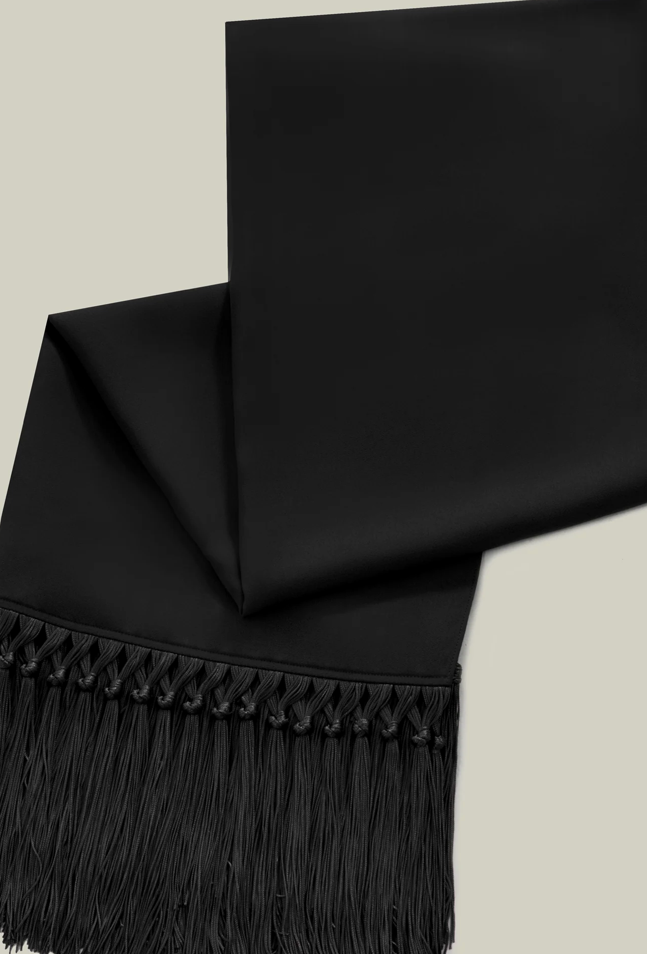 Babe stole in black with fringe by Taller Marmo from Blackbird Collection's sustainable accessories