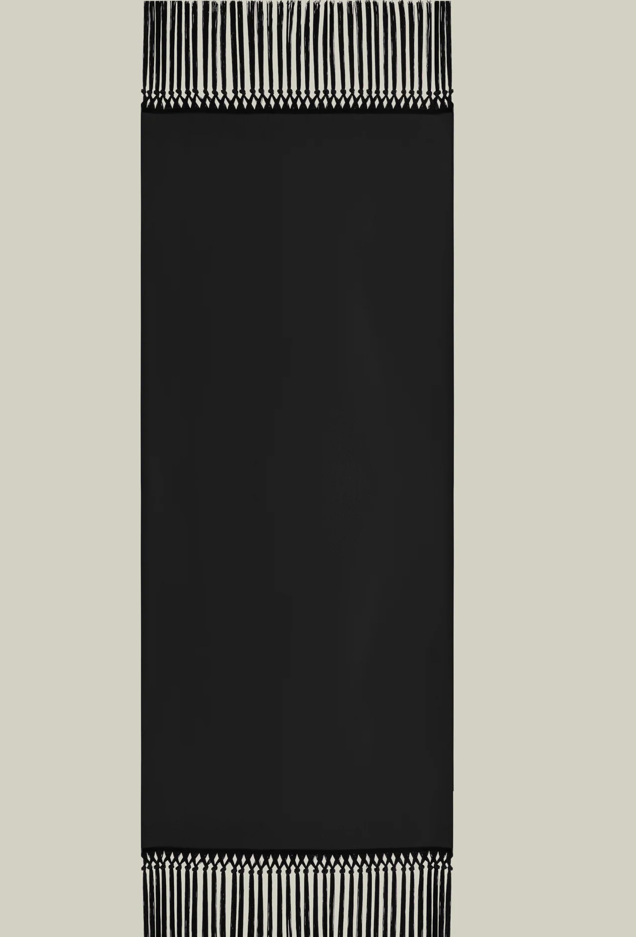 Babe stole in black with fringe by Taller Marmo from Blackbird Collection's sustainable accessories