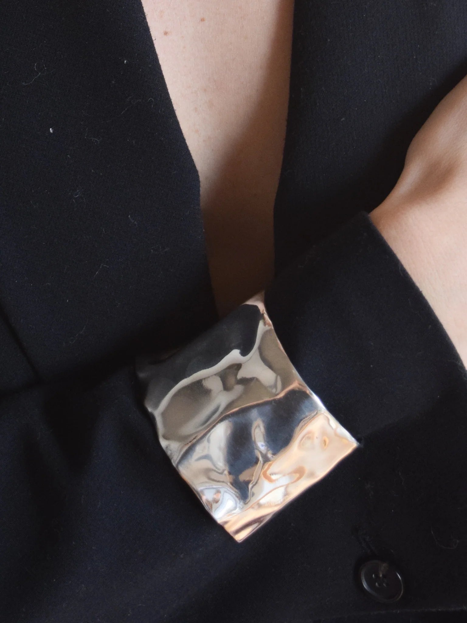 Sterling silver dented cuff by Erea organic shaped modern bracelet from Blackbird Collection's sustainable accessories and jewelry