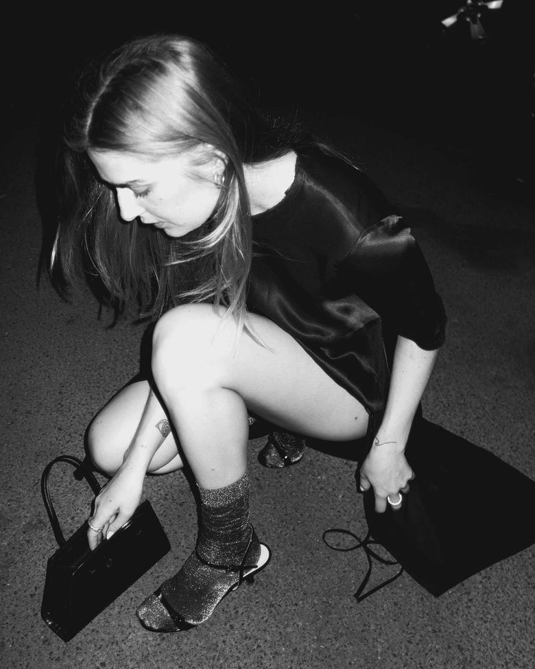 Ines semi-sheer shimmery socks in black by Swedish Stockings from Blackbird Collection's sustainable accessories