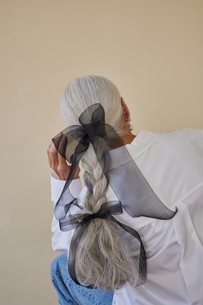 Black sheer mini hair bow barrette by Lelet from Blackbird Collection's sustainable accessories
