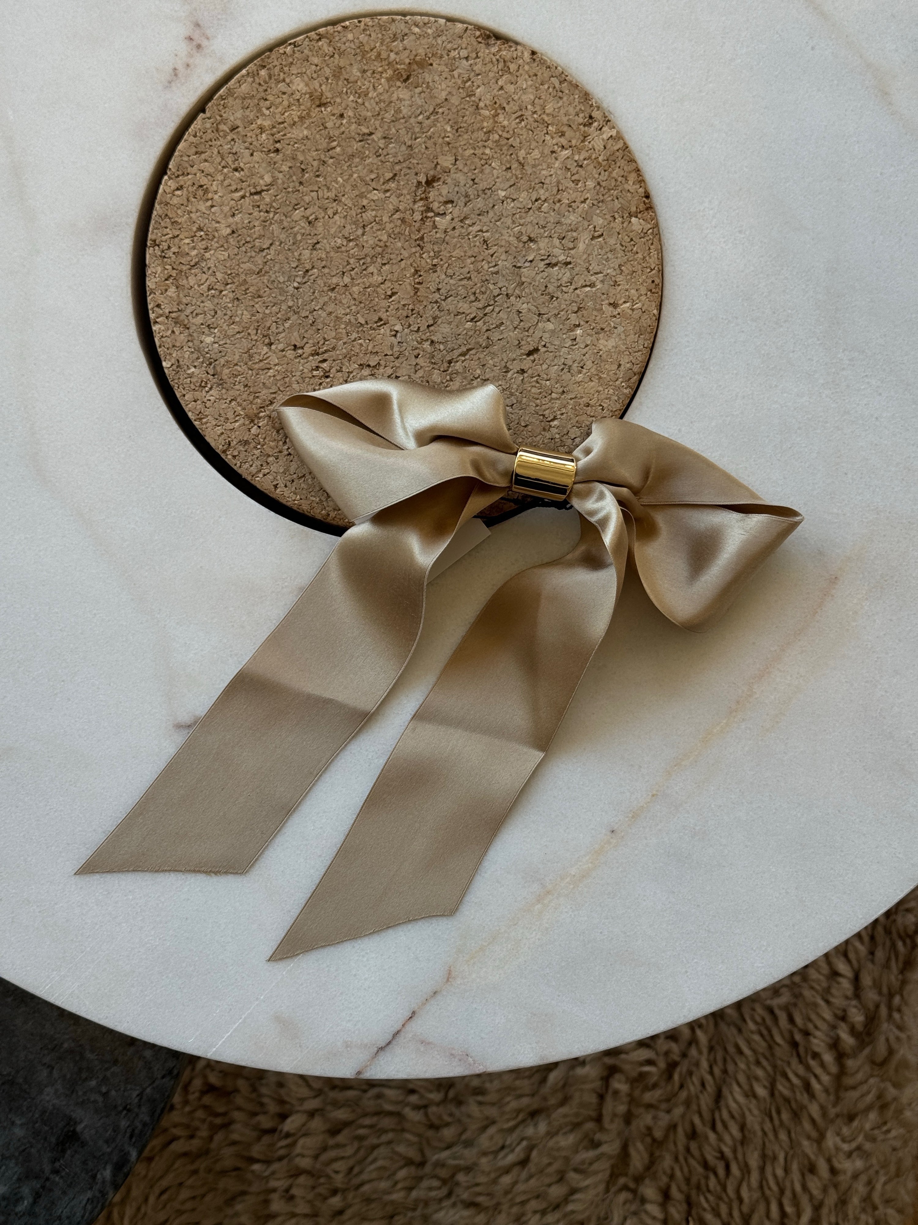 Glossy satin bow barrette hair accessory by Lelet from Blackbird Collection's sustainable accessories for women