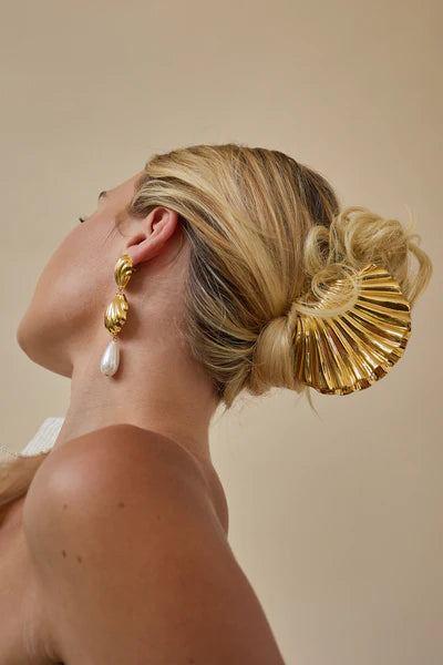 Large glossy shell hair clip in gold beach accessory by Lelet from Blackbird Collection's sustainable accessories