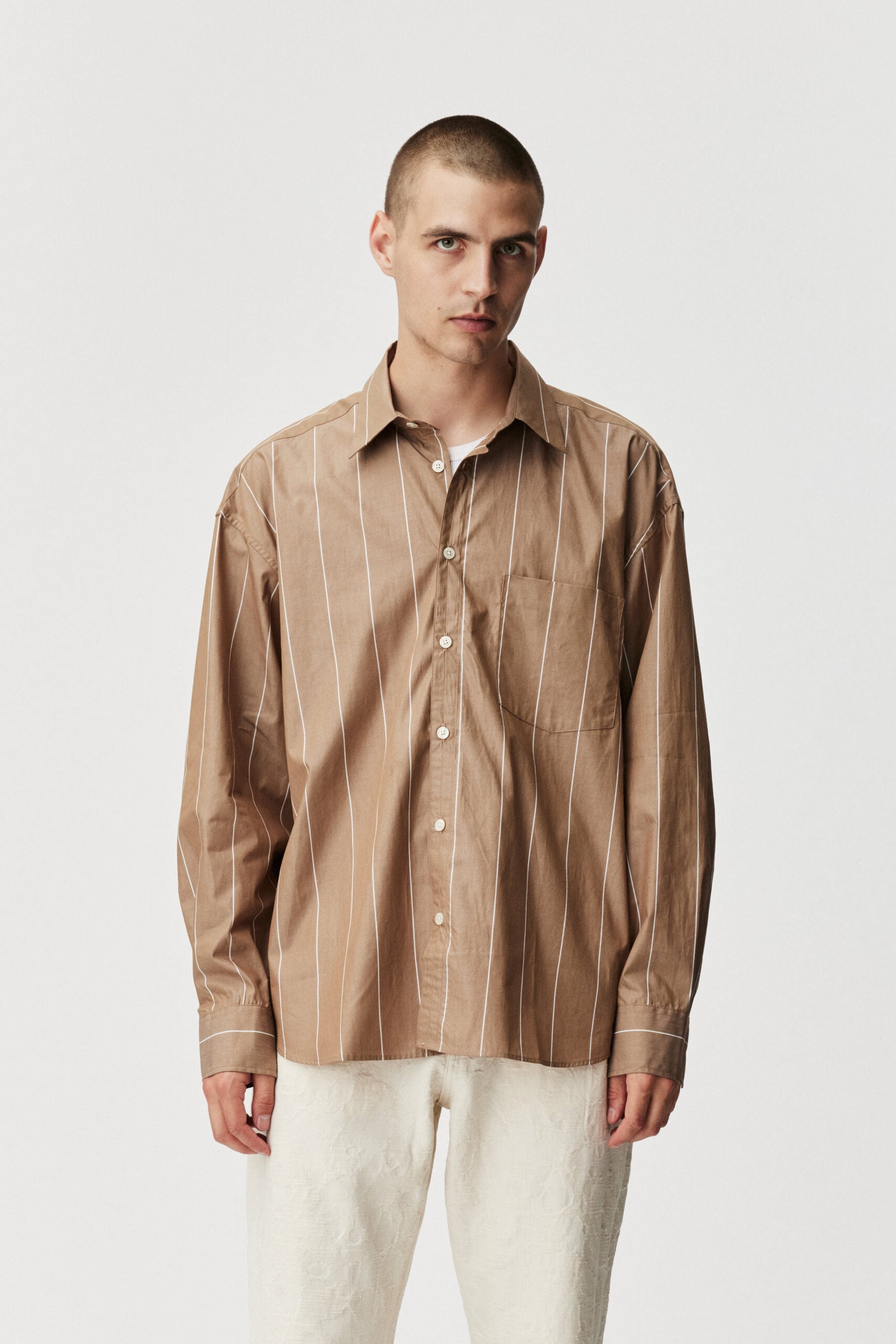 Oat stripe Taq shirt by ADNYM brown striped button down from Blackbird Collection's sustainable men’s fashion