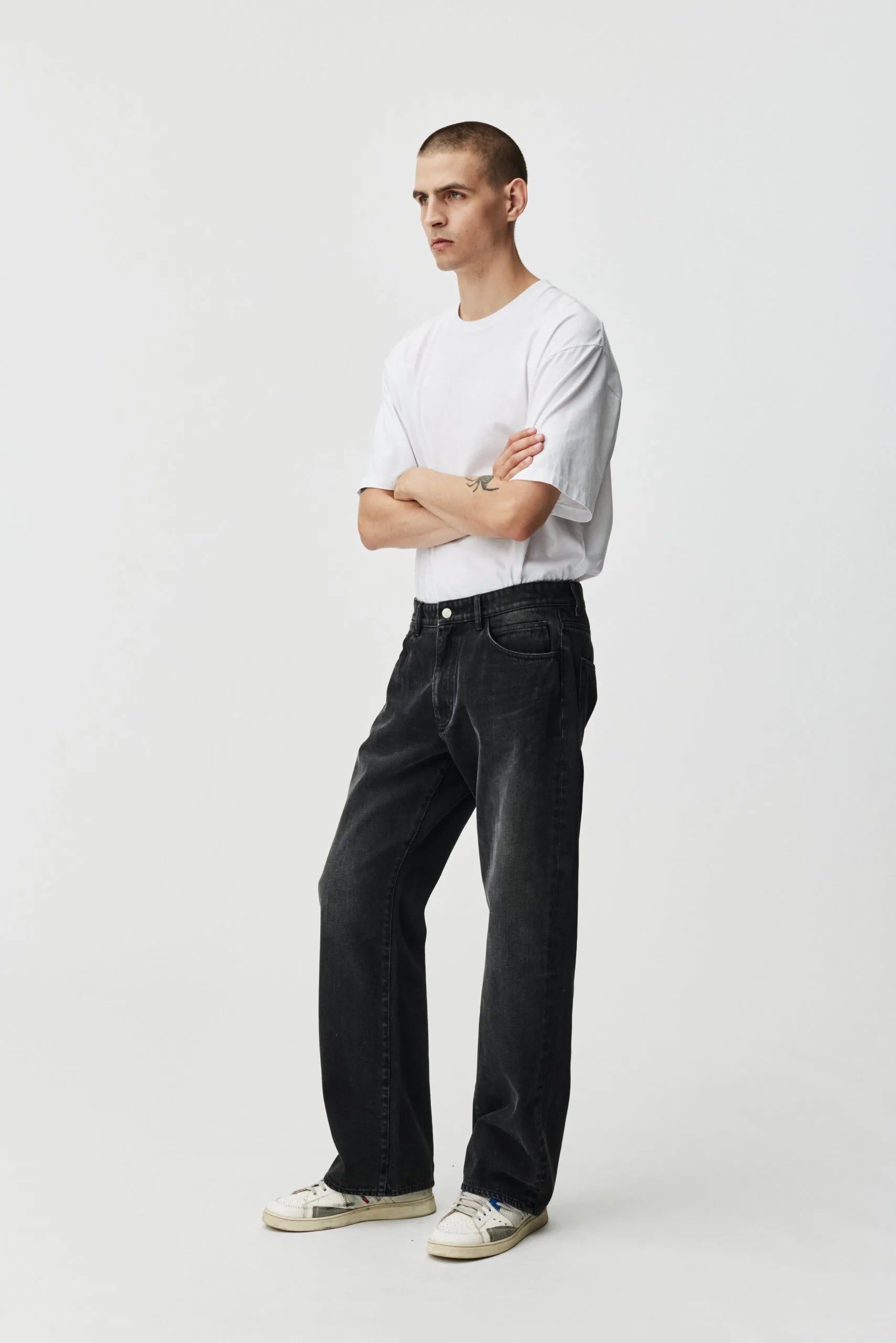 Abo 242 jean for men in distressed black by ADNYM from Blackbird Collection's sustainable fashion