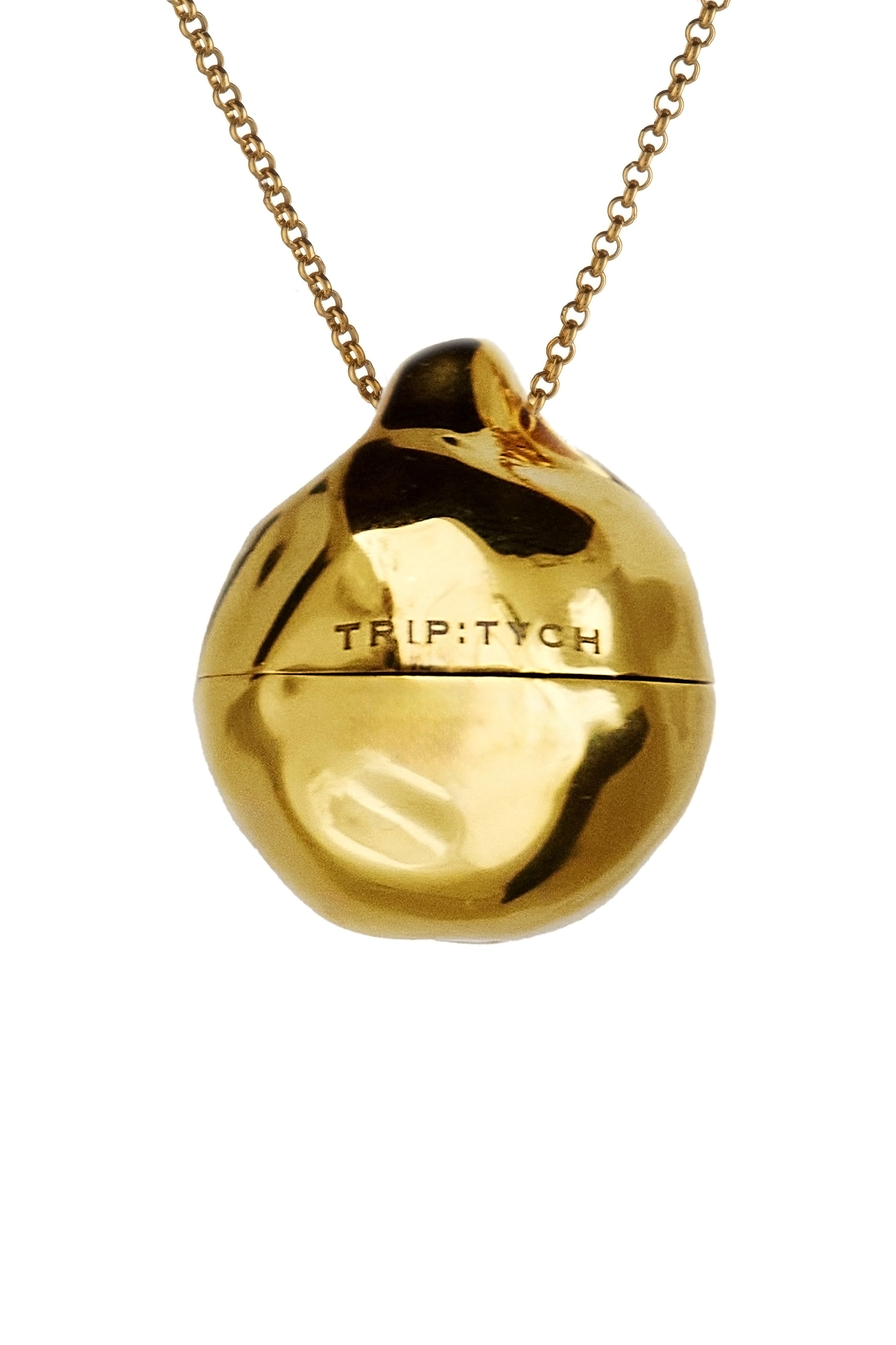 Brass bergamot solid perfume jewelry in gold organic shape by Triptych from Blackbird Collection's sustainable jewelry and accessories