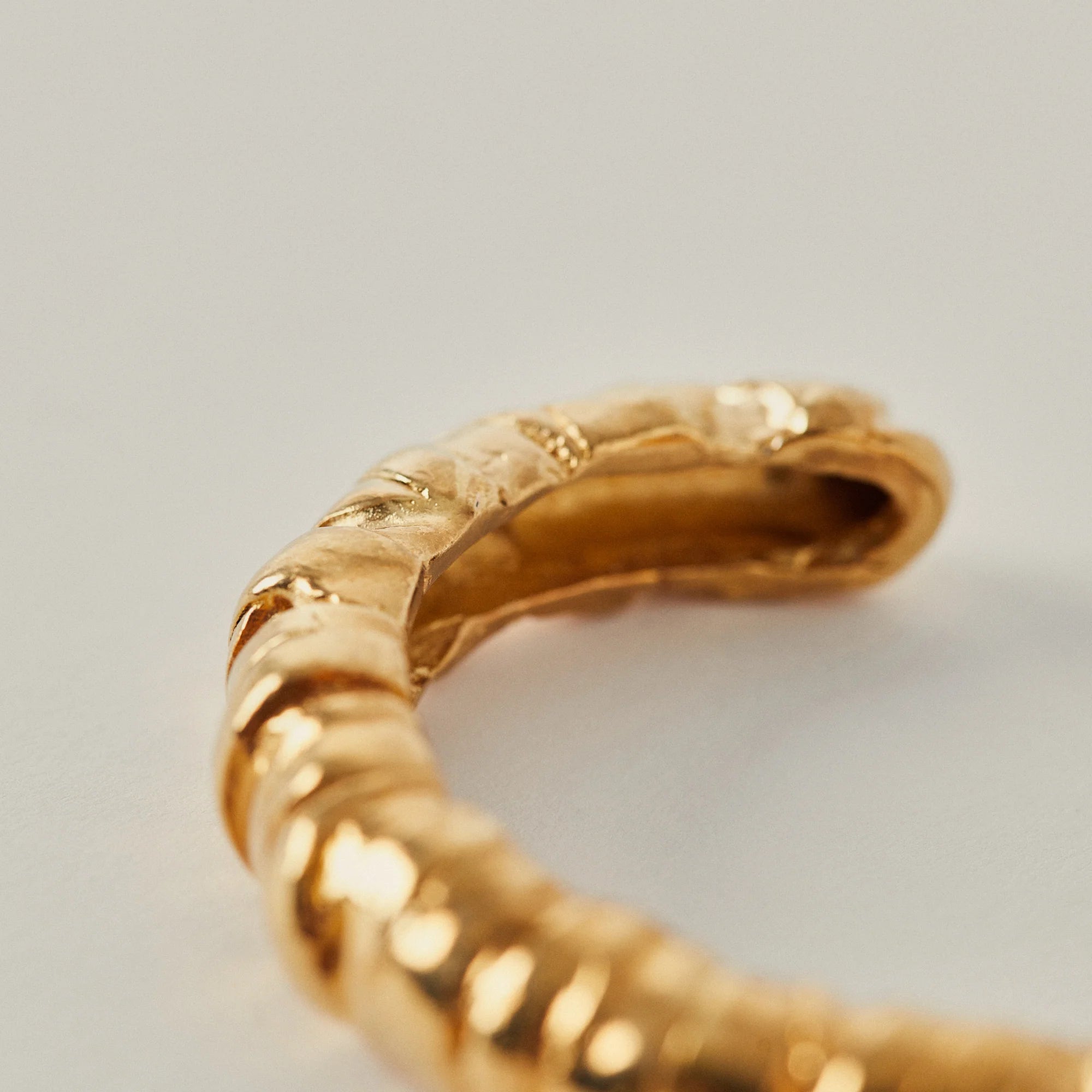 Up close Cassandra bracelet gold cuff by Paola Sighinolfi from Blackbird Collection's sustainable accessories and jewelry