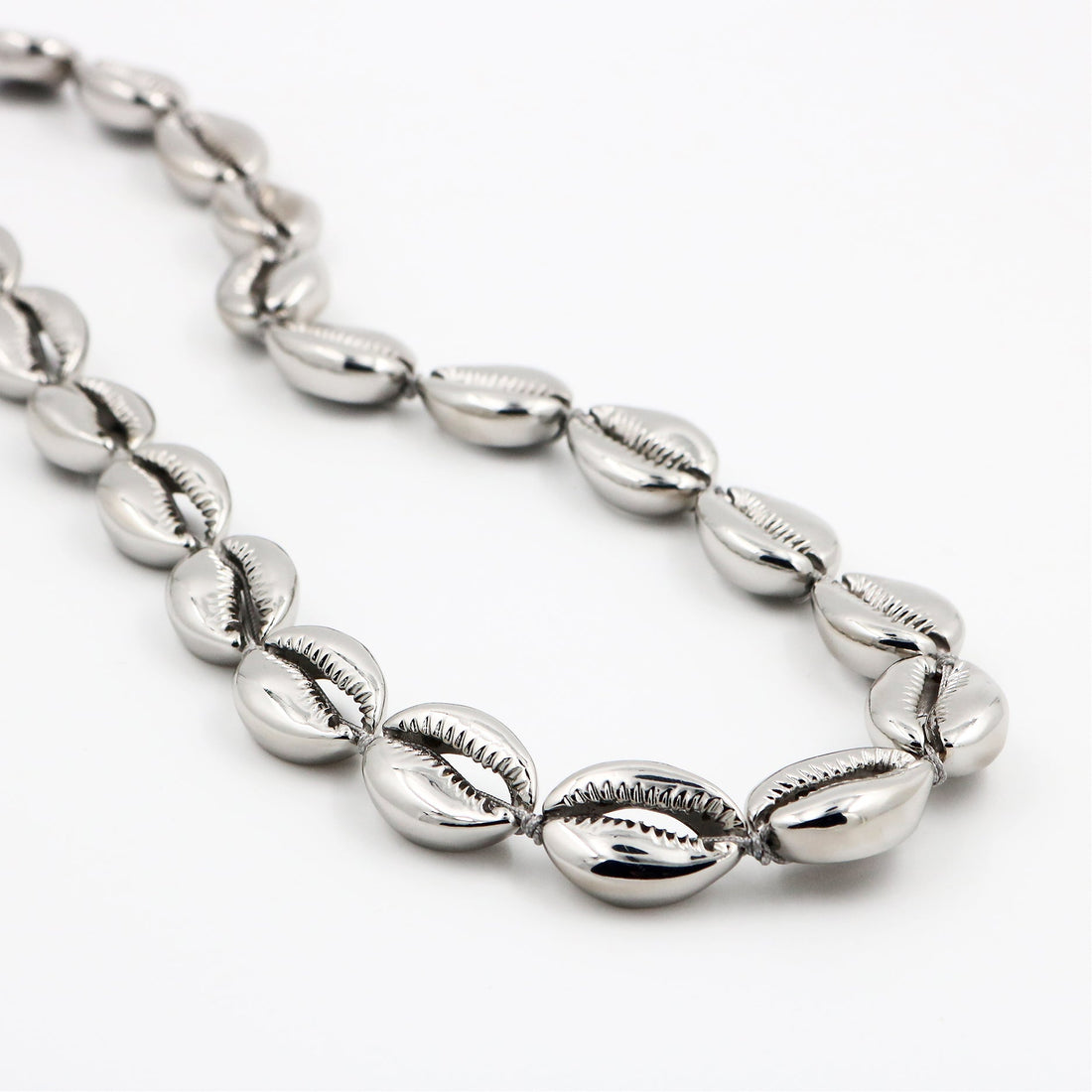 Long silver concha puka necklace by Tohum from Blackbird Collection's sustainable accessories and jewelry