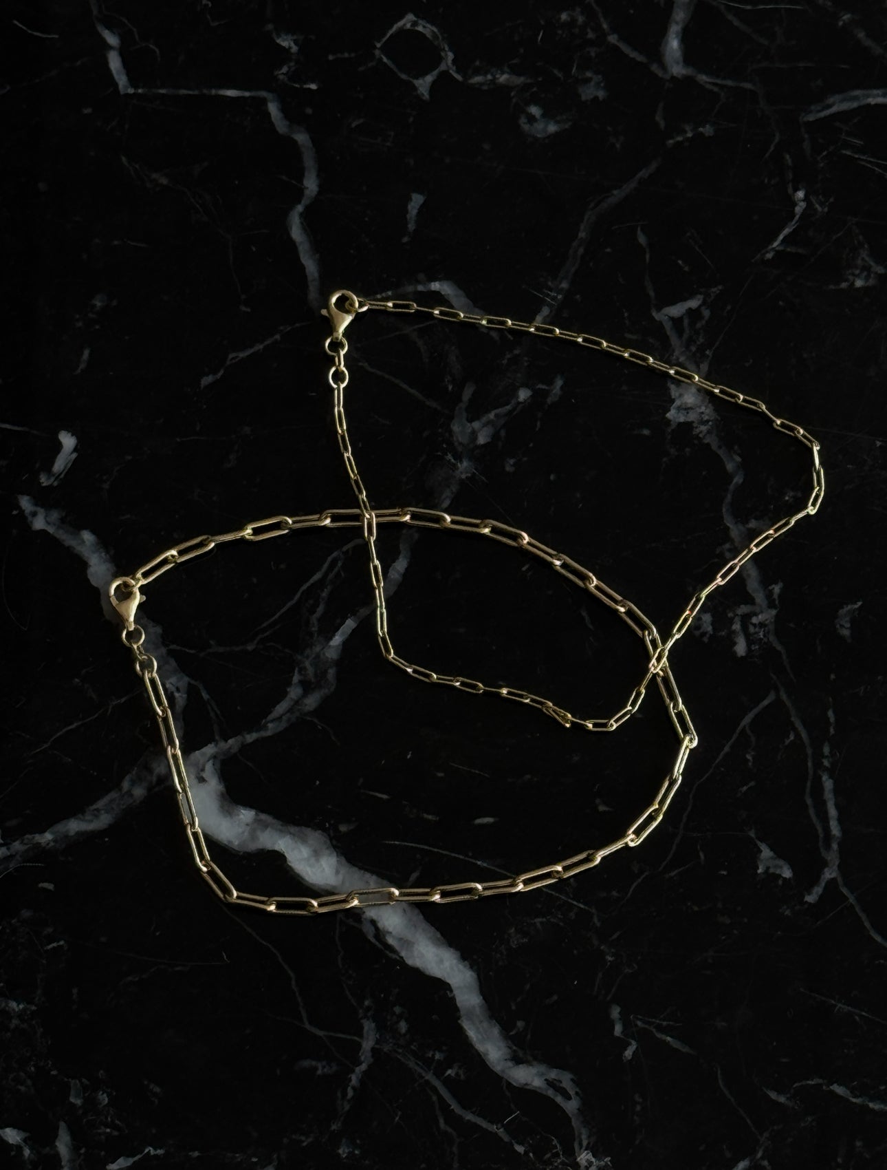 Mini paperclip anklet in gold by Enti Ana from Blackbird Collection's sustainable accessories and jewelry
