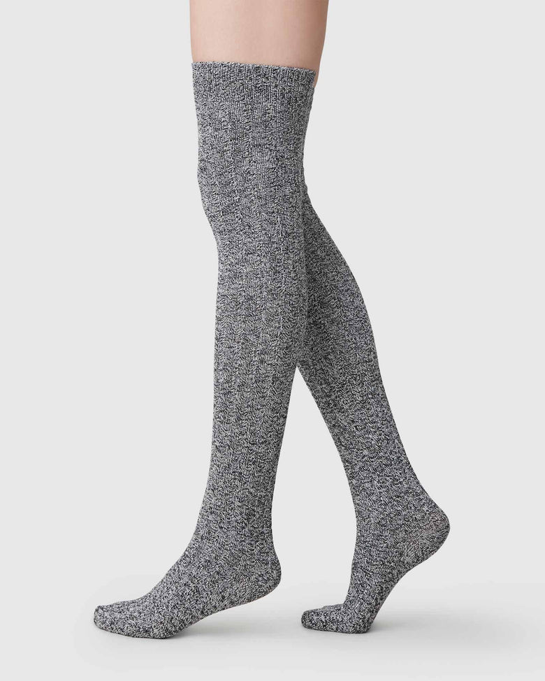 Black and grey over-knee socks by Swedish Stockings from Blackbird Collection's sustainable accessories